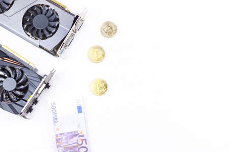 Video card and bitcoin on a white backgroundの写真素材