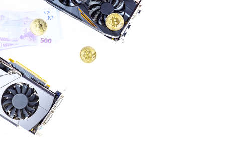 Video card and bitcoin on a white backgroundの写真素材