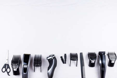 The machine for a hairstyle, the razor and scissors, the equipment for a hairdressing salon