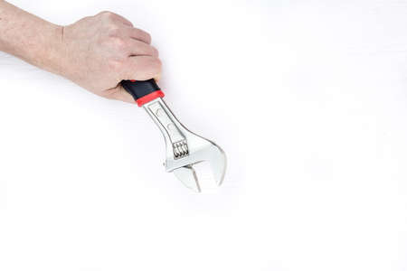 male hand with wrench on white background