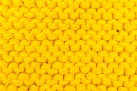 the texture of the crochet, yellow background, patterned knitted fabricの写真素材