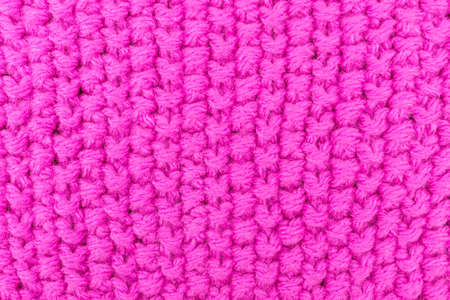 the texture of the crochet, pink background, patterned knitted fabricの写真素材