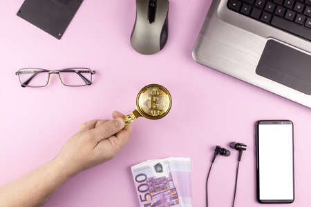 business concept on pink background, laptop, smartphone, money and glasses on pink texture