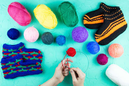 girl knits sock knitting needles on green backgroundの写真素材