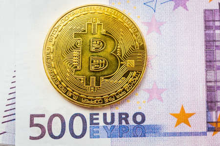 Bitcoin lies on Euro banknotes, the texture of Euro banknotes with bitcoinの写真素材