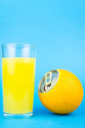 Fresh orange juice with fruits on bluebackground, Orange juice in glass on blue background