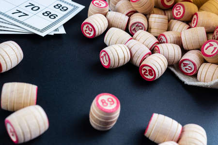 Tabletop old lotto game with wooden elements. Cards bingo