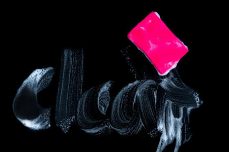 Cleaning sponge with foam for dish washing on black backgroundの写真素材