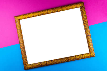 Wooden frame isolated on a blue backgroundの写真素材