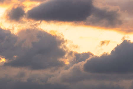 Sun beams or rays breaking through the dark clouds at sunset. Hope, prayer, God's mercy and grace....