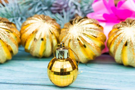 Christmas holiday composition. Red and golden Christmas decorations, baubles, fir tree branches on dark black background with copy space. Banner mockup, postcard. Flat lay, top viewの写真素材