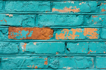 The texture of the brick wall of many rows of bricks painted in blue colorの写真素材