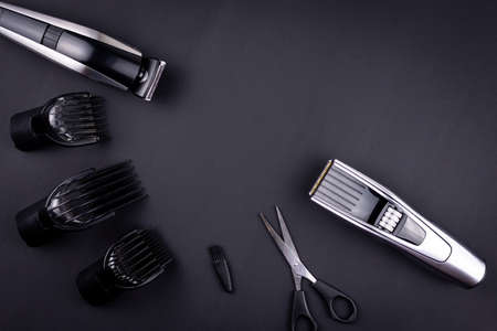 Shaving, Razor, brush, Comb, scissor, clippers and hair trimmer. Accessories for Barber shop equipment on black background Top view copyspaceの写真素材