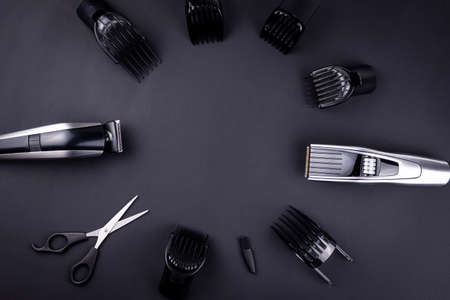 Shaving, Razor, brush, Comb, scissor, clippers and hair trimmer. Accessories for Barber shop equipment on black background Top view copyspaceの写真素材