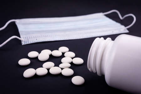 White medical mask isolated. Face mask protection against pollution, virus, flu and coronavirus. Health care and surgical concept.の写真素材