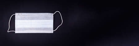 White medical mask isolated. Face mask protection against pollution, virus, flu and coronavirus. Health care and surgical concept.の写真素材