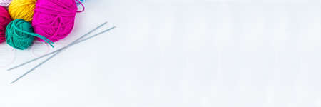 knitting ball of yarn and knitting needles on a white backgroundの写真素材