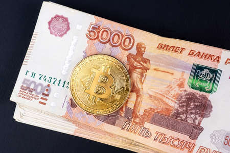 bitcoin cryptocurrency with russian rubles money, five thousand banknotes closeupの写真素材