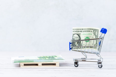 Financial concept, bank notes in the shopping cart. shopping cart with dollars banknotes. financial concept. Dollar in the basketの写真素材