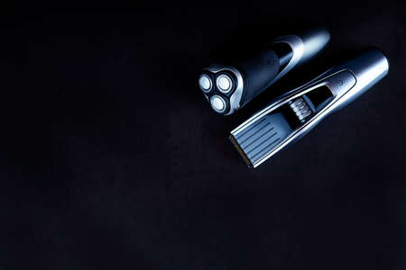 Shaving, Razor, brush, Comb, scissor, clippers and hair trimmer. Accessories for Barber shop equipment on black background Top view copyspaceの写真素材