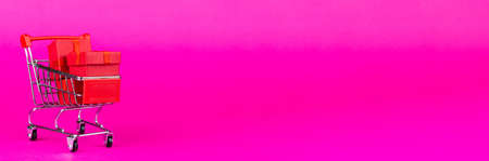 Paper art Valentine's day concept banner with handmade gift box, cut ribbon, bow with space for text. Christmas giftの写真素材