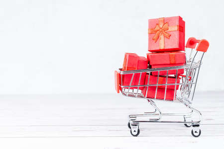 Paper art Valentine's day concept banner with handmade gift box, cut ribbon, bow with space for text. Christmas giftの写真素材