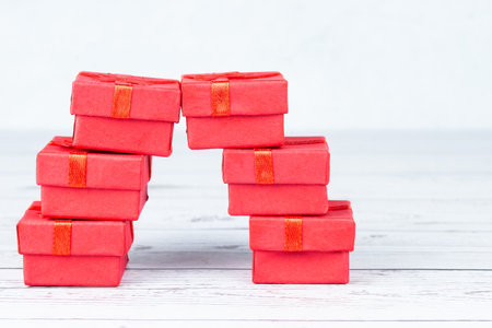 Paper art Valentine's day concept banner with handmade gift box, cut ribbon, bow with space for text. Christmas giftの写真素材