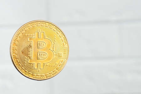 Cryptocurrency golden bitcoin coin on white background, electronic virtual money for web banking and...