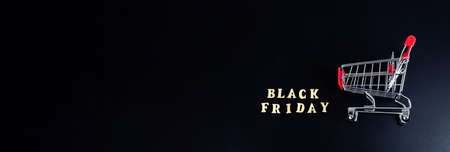 Black friday, discounts and season sales concept. Banner with grocery cart and words BLACK FRIDAY...