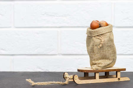 Nutritious hazelnuts in a basket and scattered on the ground. Hazelnuts in a shopping basket....