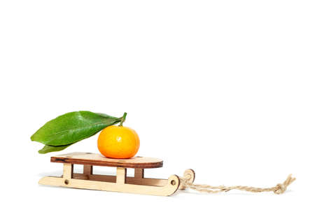 Ripe mandarines with leaves close-up on a white background. Tangerines with leaves on a white background.の写真素材