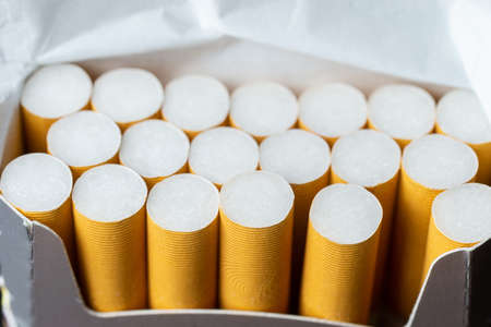 Close up cigarette in pack is addictive to be cancer.smoking reduction campaign in World No Tobacco Day.の写真素材