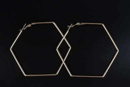 Diamond jewelry earrings, luxury silver and gold earrings with diamonds, sapphires in black background.の写真素材