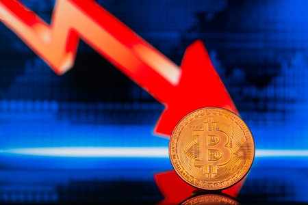 Close up photo of golden shiny litecoin standing on the background with digital colorful candle graphs showing falling of the crypto currencyの写真素材