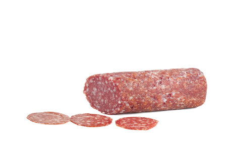 heap of slices of cervelat sausage isolated on white background. High quality photoの写真素材