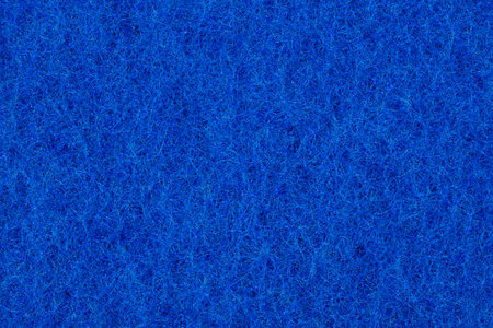 Background in the form of honeycomb structure of blue color. Close-up sponge.の写真素材