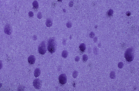purple sponges for washing dishes and other items, close-up of kitchen spongesの写真素材