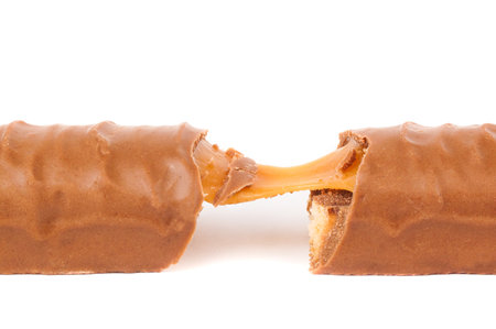 chocolate bar with caramel on white backgroundの写真素材