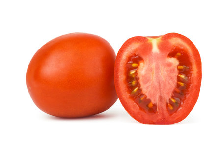 Tomato vegetables isolated on white background. One whole tomato and cut sliceの写真素材