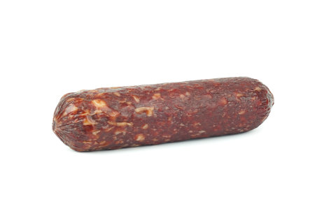 A piece of dry salami sausage, highlighted on a white backgroundの写真素材
