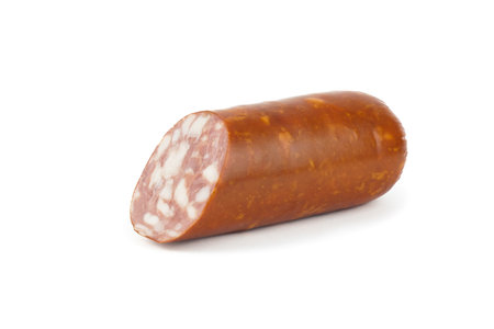 A piece of dry salami sausage, highlighted on a white backgroundの写真素材