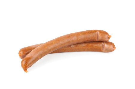 Smoked grilled thin Pork Sausages, close-up, isolated on white background.の写真素材