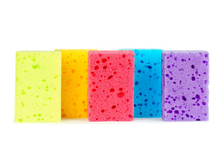Multicolored sponges for washing dishes isolated on white backgroundの写真素材