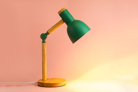 A glowing lamp on a pink background