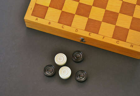 Sports or recreation Board game board with checkers. Hobby. Checkers on the playing field for the...