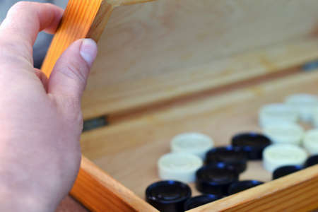 Sports or recreation Board game board with checkers. Hobby. Checkers on the playing field for the...