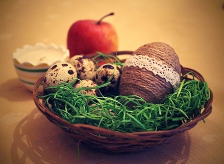 Easter still life on the table with quail eggs.