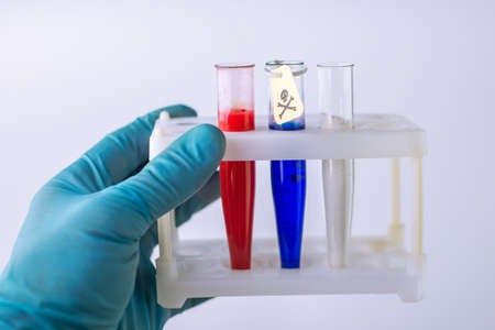 Russian-made poisons - 3 test tubes with Russian flag colors, yellow tag, toxic hazard signの写真素材