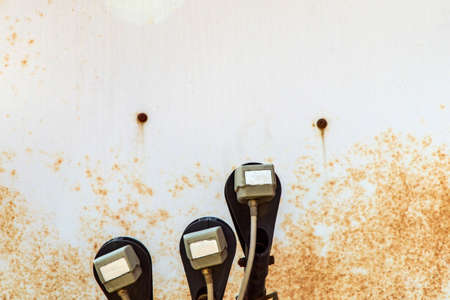 outdated technology background: rusty surface of a satellite dish with antennasの写真素材