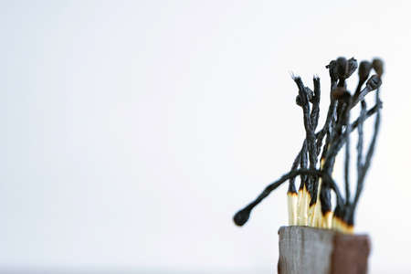 a series of burned matches, the embers went out, there is no more smoke, a short focus